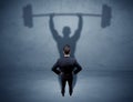 Businessman with weight lifting shadow Royalty Free Stock Photo