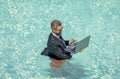 businessman in wet suit in swim pool. Remote working. Summer business dreams. successful man. Businessman in suit with Royalty Free Stock Photo