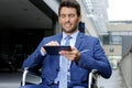 Businessman in wheelchair using digital tablet