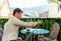 Businessman in white shirt in bar smoking shisha Royalty Free Stock Photo