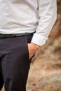Businessman in a white shirt holding hands in his pockets. A businessman is standing with his hand in his pocket. Business concept Royalty Free Stock Photo