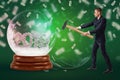 A businessman who has just crashed a crystal ball with the date `2019` inside formed with dollar bills with money Royalty Free Stock Photo