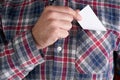 Businessman who takes out blank business card from the pocket of his shirt Royalty Free Stock Photo