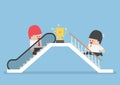 Businessman who use escalator to success and his rival climbing