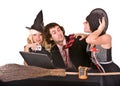 Businessman, witch girl, laptop,broom in office Royalty Free Stock Photo