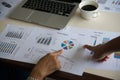 Businessman and woman discussing on stock market charts in office. Royalty Free Stock Photo