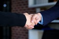 Businessman and woman handshake at office, business cooperation, success in business concept Royalty Free Stock Photo