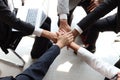 Businessman and woman putting hands join together, business partnership colleagues holding hands as commitment of strong team work Royalty Free Stock Photo