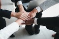 Businessman and woman putting hands join together, business partnership colleagues holding hands as commitment of strong team work Royalty Free Stock Photo