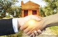 Businessman and woman real state handshake partners. Royalty Free Stock Photo