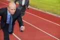 Businessman and woman on running on race track Royalty Free Stock Photo