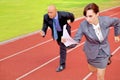 Businessman and woman on running on race track Royalty Free Stock Photo