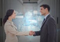Businessman and woman shaking hands each other in office corridor Royalty Free Stock Photo