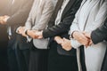 Businessman and woman stand in a row while holding hand Royalty Free Stock Photo