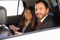 Businessman and woman working in a car Royalty Free Stock Photo