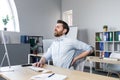 Businessman at work, tired has severe back pain Royalty Free Stock Photo