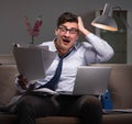 Businessman workaholic working late at home Royalty Free Stock Photo