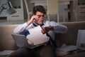 The businessman workaholic working late at home Royalty Free Stock Photo