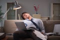 The businessman workaholic working late at home Royalty Free Stock Photo