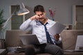 The businessman workaholic working late at home Royalty Free Stock Photo