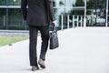 Businessman or worker standing in suit near office building Royalty Free Stock Photo