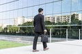Businessman or worker standing in suit near office building Royalty Free Stock Photo