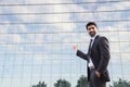 Businessman or worker standing in suit near office building Royalty Free Stock Photo