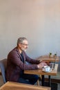 Businessman working in a cafe and looking seriosu Royalty Free Stock Photo