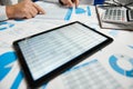 Businessman working and calculating, reads and writes reports. Using tablet pc. Office employee, table closeup. Business financial Royalty Free Stock Photo