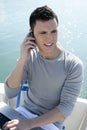 Businessman working with computer on a boat Royalty Free Stock Photo