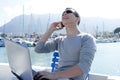 Businessman working with computer on a boat Royalty Free Stock Photo