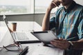 Businessman working on computer. Men using digital tablet and laptop in the office.