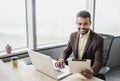 Businessman working on computer. Young men using digital tablet and laptop in office. Internet marketing, finance, business concep Royalty Free Stock Photo