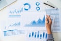 Businessman working data document graph chart report marketing research development planning management strategy analysis