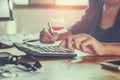 businessman working on desk office using calculator business fin