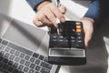 businessman working on desk office with using a calculator to calculate the numbers, finance accounting concept Royalty Free Stock Photo