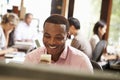 Businessman Working At Desk Using Mobile Phone Royalty Free Stock Photo