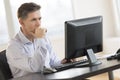 Businessman Working On Desktop Pc In Office