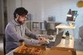 Businessman working and eating at office