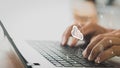 Businessman working on his laptop in the home office selects icon cloud on the virtual display. cloud computing technology, intern