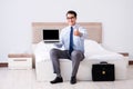 The businessman working in hotel room Royalty Free Stock Photo