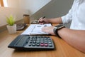 Businessman working with income statement document on the wood table.Business concept Royalty Free Stock Photo