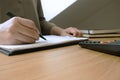 Businessman working with income statement document on the wood table.Business concept Royalty Free Stock Photo