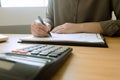 Businessman working with income statement document on the wood table. Business concept. Royalty Free Stock Photo