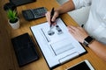 Businessman working with income statement document on the wood table.Business concept Royalty Free Stock Photo