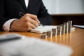 Businessman working with income statement document on the wood table.Business concept Royalty Free Stock Photo