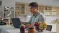 Businessman working kitchen table with laptop close up. Student studying online Royalty Free Stock Photo