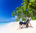 Businessman Working with Laptop on Beach Royalty Free Stock Photo