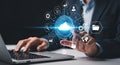 Businessman working on laptop with cloud computing and data storage icons Royalty Free Stock Photo
