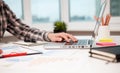 businessman working laptop at the desk in modern office